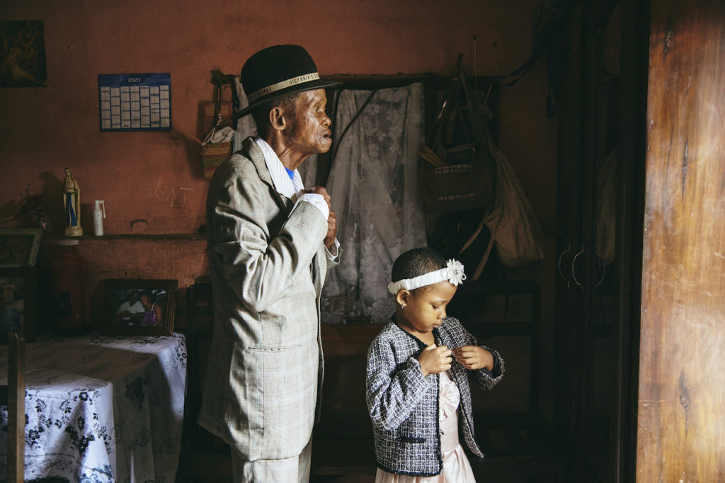 Dada Paul Rakotazandriny (91), who is living with dementia, and his granddaughter, Odliatemix Rafaraniriana (5), get ready for church on Sunday morning at his home in Antananarivo, Madagascar. 12 March 2023