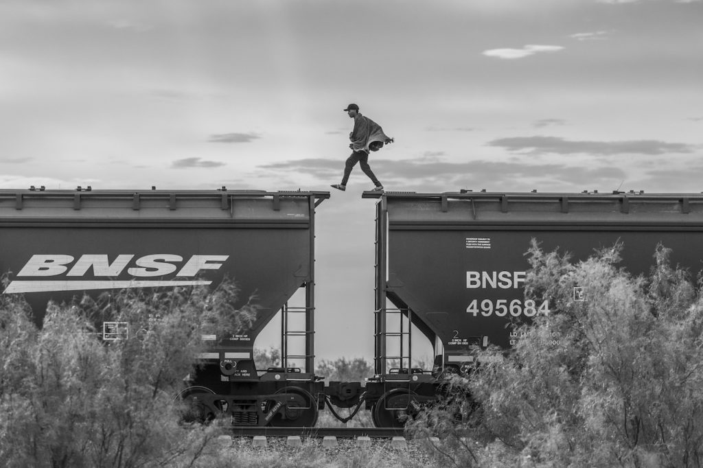 A migrant walks over a freight train known as the beast as he arrives at Piedras Negras, in Piedras Negras, Oct 8, 2023.