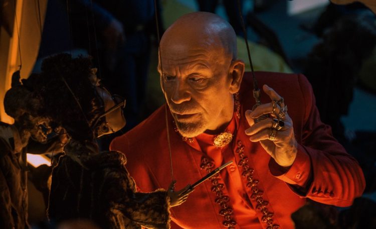 Jhon Malkovich in Opus il debutto alla regia di Il debutto alla regia di Mark Anthony Green.